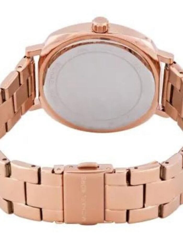 Marque: Michael Kors Modèle: NIA Boîtier: Diamètre : 38 mm Epaisseur : 8 mm Acier inoxydable Bronze Cadran: Verre : Minéral Bronze Bracelet: Acier inoxydable Bronze Etanchéité: 50 m (5 ATM) Type de boucle: Boucle déployant